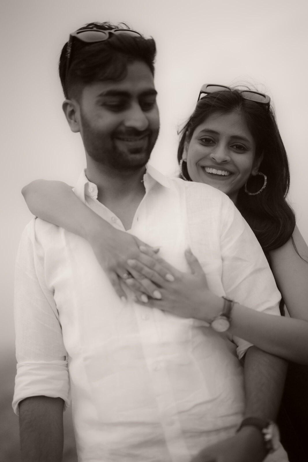 Priya and Ashish in an intimate black-and-white portrait embrace